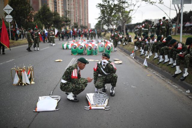 Military members wait to take part in a military parade commemorating Colombia's Independence Day in Bogota, on July 20, 2026. (Photo by ESTEBAN VEGA LA-ROTTA / AFP)