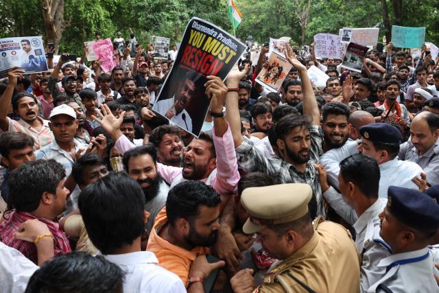 Banaras Hindu University (BHU) students in solidarity with Cockroach Janta Party (CJP) clash with security personnel during a protest demanding the resignation of India's Education Minister Dharmendra Pradhan over alleged NEET exam irregularities, in Varanasi on July 20, 2026. Indian police fired tear gas and baton-charged protesters in New Delhi on July 20, as they tried to march on parliament to demand the resignation of the education minister over irregularities in major examinations. (Photo by Niharika KULKARNI / AFP)