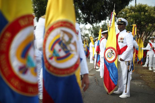 Military members wait to take part in a military parade commemorating Colombia's Independence Day in Bogota, on July 20, 2026. (Photo by ESTEBAN VEGA LA-ROTTA / AFP)