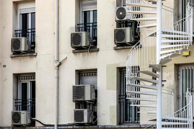 This photograph shows condensers of air conditioning units outside flats in Paris on July 20, 2026. (Photo by Joel Saget / AFP)