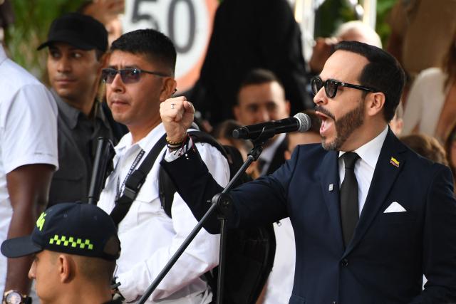 Colombia's president-elect Abelardo de la Espriella (R) delivers a speech during a military parade commemorating Colombia's Independence Day in Medellin, Colombia, on July 20, 2026. (Photo by Jaime SALDARRIAGA / AFP)
