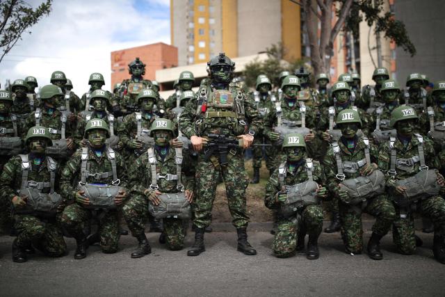 Military members pose before a military parade commemorating Colombia's Independence Day in Bogota, on July 20, 2026. (Photo by ESTEBAN VEGA LA-ROTTA / AFP)