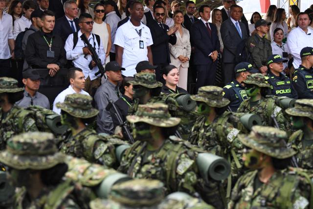 Colombia's president-elect Abelardo de la Espriella (C, top) applauds next to his wife Ana Lucia Pineda during a military parade commemorating Colombia's Independence Day in Medellin, Colombia, on July 20, 2026. (Photo by Jaime SALDARRIAGA / AFP)