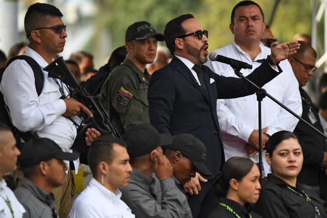Colombia's president-elect Abelardo de la Espriella (R) delivers a speech during a military parade commemorating Colombia's Independence Day in Medellin, Colombia, on July 20, 2026. (Photo by Jaime SALDARRIAGA / AFP)