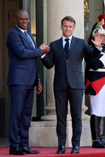Gabon's President Brice Oligui Nguema (L) is welcomed by France's President Emmanuel Macron before a meeting at the Elysee Palace in Paris on July 20, 2026. (Photo by Ludovic MARIN / AFP)