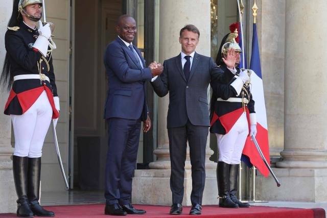 Gabon's President Brice Oligui Nguema is welcomed by France's President Emmanuel Macron before a meeting at the Elysee Palace in Paris on July 20, 2026. (Photo by Ludovic MARIN / AFP)
