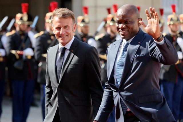 Gabon's President Brice Oligui Nguema (R) is welcomed by France's President Emmanuel Macron before a meeting at the Elysee Palace in Paris on July 20, 2026. (Photo by Ludovic MARIN / AFP)