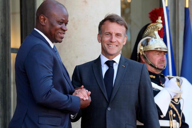 Gabon's President Brice Oligui Nguema (L) is welcomed by France's President Emmanuel Macron before a meeting at the Elysee Palace in Paris on July 20, 2026. (Photo by Ludovic MARIN / AFP)