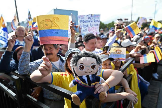 Supporters of Colombia's President Gustavo Petro wait for his speech and a military parade to commemorate Colombia's Independence Day with signs, flags and a doll depicting him, in Bogota, on July 20, 2026. (Photo by LUIS ACOSTA / AFP)