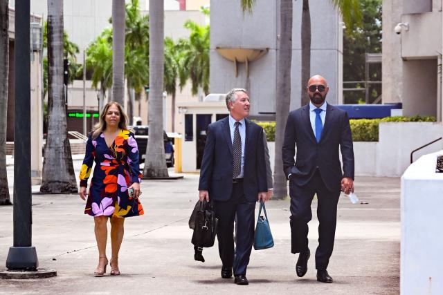 Joseph D. McBride (R), attorney for Andrew Tate and Tristan Tate, arrives ahead of the hearing for the Tate brothers at the C. Clyde Atkins US Courthouse in Miami, Florida, on July 20, 2026. Radical social media influencer Andrew Tate and his brother Tristan were in custody in the US on July 19,  officials said, as Britain seeks their extradition to face new charges of rape, sex trafficking and assault. (Photo by CHANDAN KHANNA / AFP)