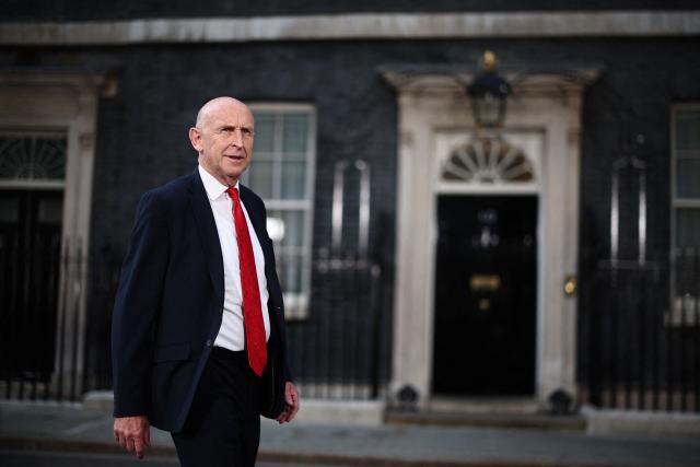 Britain's former Defence secretary John Healey leaves 10 Downing Street in London July 20, 2026 as cabinet appointments are being made after Andy Burnham became Britain's new Prime Minister. Britain's new Prime Minister Andy Burnham appointed John Healey, who was defence secretary under his predecessor, to the top job of finance minister, known as Chancellor of the Exchequer, Downing Street said Monday. (Photo by Henry Nicholls / AFP)