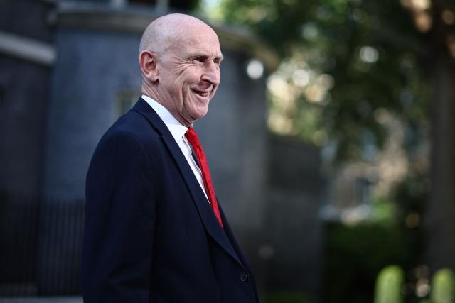 Britain's former Defence secretary John Healey smiles as he leaves 10 Downing Street in London July 20, 2026 as cabinet appointments are being made after Andy Burnham became Britain's new Prime Minister. Britain's new Prime Minister Andy Burnham appointed John Healey, who was defence secretary under his predecessor, to the top job of finance minister, known as Chancellor of the Exchequer, Downing Street said Monday. (Photo by Henry Nicholls / AFP)