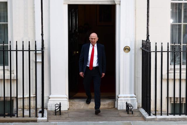 Britain's former Defence secretary John Healey leaves 11 Downing Street in London July 20, 2026 as cabinet appointments are being made after Andy Burnham became Britain's new Prime Minister. Britain's new Prime Minister Andy Burnham appointed John Healey, who was defence secretary under his predecessor, to the top job of finance minister, known as Chancellor of the Exchequer, Downing Street said Monday. (Photo by Peter Nicholls / AFP)