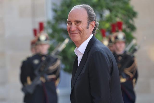 French businessman Xavier Niel arrives for a State diner on the sidelines of the State Visit of Gabon's President at the Elysee Palace in Paris on July 20, 2026. (Photo by Ludovic MARIN / AFP)