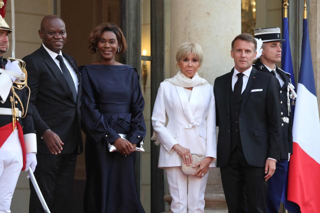 Gabon's President Brice Oligui Nguema and his wife Zita Oligui Nguema  are welcomed by France's President Emmanuel Macron and his wife Brigitte Macron (R) before a State diner at the Elysee Palace in Paris on July 20, 2026. (Photo by Ludovic MARIN / AFP)