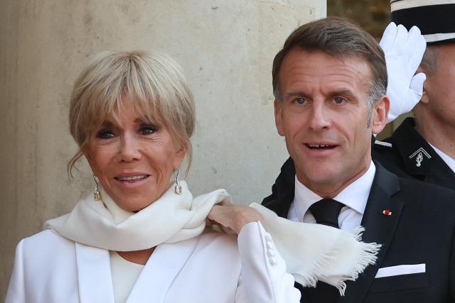 France's President Emmanuel Macron and his wife Brigitte Macron arrive to welcome Gabon's President and his wife before a State diner at the Elysee Palace in Paris on July 20, 2026. (Photo by Ludovic MARIN / AFP)