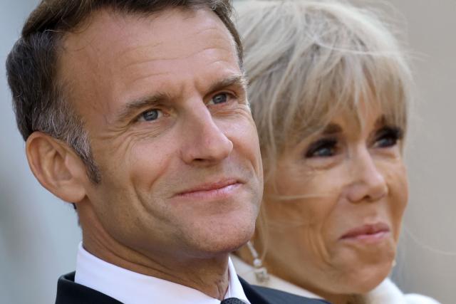 France's President Emmanuel Macron and his wife Brigitte Macron arrive to welcome Gabon's President and his wife before a State diner at the Elysee Palace in Paris on July 20, 2026. (Photo by Ludovic MARIN / AFP)