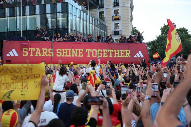 Spain's players parade onboard an open-top bus through the streets of Madrid on July 20, 2026, one day after the national football team won their second World Cup title following a 1-0 victory against Argentina. Spain's World Cup winners come back home to a heroes' welcome in Madrid, where a million fans are expected to greet them after a night of raucous celebrations across the country. (Photo by Thomas COEX / AFP)