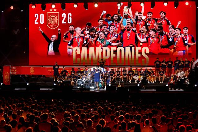 Spain's captain Rodri (C) speaks as Spain's players celebrate on a stage at Cibeles Square in Madrid on July 20, 2026, one day after winning their second World Cup title following a 1-0 victory against Argentina. Spain's World Cup winners come back home to a heroes' welcome in Madrid, where a million fans are expected to greet them after a night of raucous celebrations across the country. (Photo by Oscar DEL POZO / AFP)