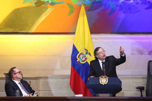 Colombia's President Gustavo Petro (R) delivers a speech alongside outgoing Senate President Lidio Garcia during the installation of the ordinary sessions of the Congress in Bogota on July 20, 2026. (Photo by ESTEBAN VEGA LA-ROTTA / AFP)