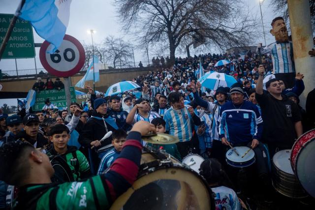 Fans play drums as they gather outside the Argentine Football Association (AFA) training camp in Ezeiza, Buenos Aires Province, on July 20, 2026, while waiting for the arrival of Argentina's national football team from the United States following their defeat in the 2026 FIFA World Cup final. (Photo by TOMAS CUESTA / AFP)