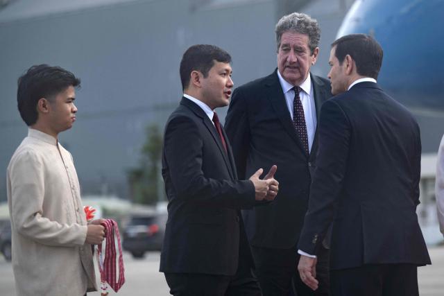US Ambassador to the Philippines Lee Lipton (2nd-R), listens to US Ambassador to ASEAN Kevin Kim (2nd-L) speaking with US Secretary of State Marco Rubio upon his arrival at Ninoy Aquino International Airport in Manila on July 21, 2026. (Photo by Brendan Smialowski / POOL / AFP)