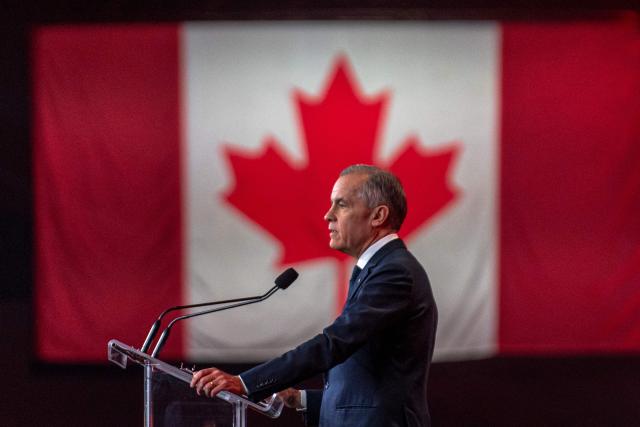 (FILES) Canadian Prime Minister Mark Carney speaks during the 2026 Liberal National Convention in Montreal, Canada, on April 11, 2026. On July 20 Canadian Prime Minister Mark Carney said that Ottawa stands ready to deepen trade talks with the United States, after US President Donald Trump ordered fresh tariffs targeting Canada. "This is the latest in a series of unilateral US trade actions that began with the US imposing a series of tariffs in direct violation of the Canada-United States-Mexico Agreement," Carney said of Trump's plan for 50-percent duties on many Canadian products. (Photo by ANDREJ IVANOV / AFP)