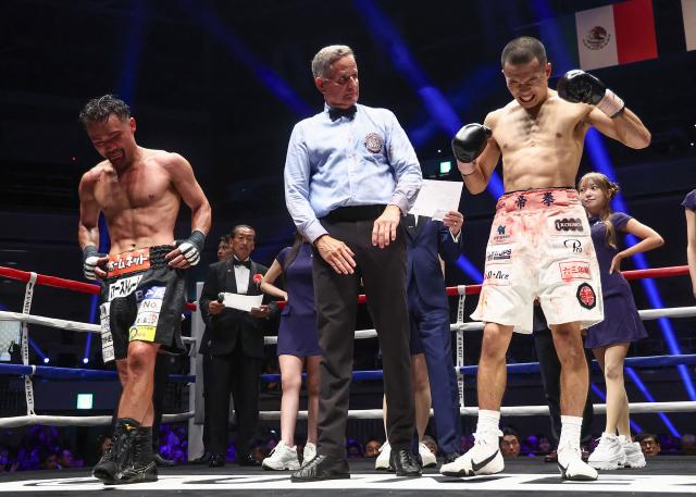 Riku Masuda (R) celebrates defeating Daigo Higa after their WBA bantamweight title bout at Ryogoku Kokugikan arena in Tokyo on July 20, 2026. (Photo by JIJI Press / AFP) / Japan OUT