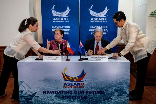 Philippines Foreign Secretary Theresa Lazaro (2nd-L) and New Zealand Foreign Minister Winston Peters (2nd-R) prepare to sign an agreement during a bilateral meeting on the sidelines of the Association of Southeast Asian Nations (ASEAN) Foreign Ministers' Meeting in Pasay, Metro Manila on July 21, 2026. (Photo by Ezra Acayan / POOL / AFP)