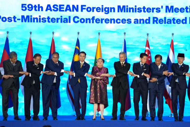 Philippine Foreign Secretary Theresa Lazaro (C) and foreign ministers from the Association of Southeast Asian Nations (ASEAN) countries pose for a group photo during the opening ceremony of the ASEAN Foreign Ministers' Meeting in Pasay, Metro Manila on July 21, 2026. (Photo by Aaron Favila / POOL / AFP)