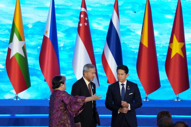 Philippine Foreign Secretary Theresa Lazaro (L), Singapore's Foreign Minister Vivian Balakrishnan (C) and Brunei's Foreign Minister Prince Abdul Mateen Bolkiah talk during the opening ceremony of the Association of Southeast Asian Nations (ASEAN) Foreign Ministers' Meeting in Pasay, Metro Manila on July 21, 2026. (Photo by Aaron Favila / POOL / AFP)