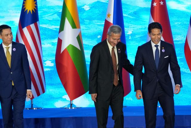 Singapore's Foreign Minister Vivian Balakrishnan (C) and Brunei's Foreign Minister Prince Abdul Mateen Bolkiah talk during the opening ceremony of the Association of Southeast Asian Nations (ASEAN) Foreign Ministers' Meeting in Pasay, Metro Manila on July 21, 2026. (Photo by Aaron Favila / POOL / AFP)