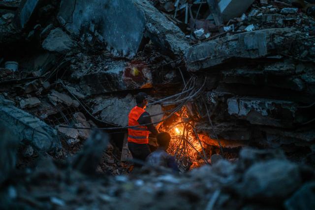 A worker cuts metal amid the rubble of a residential building that collapsed following the June 24 earthquakes, in Caraballeda, Venezuela, on July 20, 2026. The number of people killed in the powerful dual Venezuela earthquakes last month rose to 5,278, according to official figures updated Monday. The June 24 earthquakes, which recorded magnitudes of 7.2 and 7.5, profoundly impacted the north of the country, particularly the coastal state of La Guaira, near the capital Caracas. (Photo by Juan BARRETO / AFP)