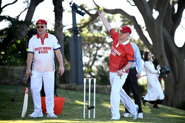 Australian Prime Minister Anthony Albanese plays a shot as he takes part in a charity backyard cricket match at Kirribilli House in Sydney on July 21, 2026. (Photo by DAN HIMBRECHTS / POOL / AFP)