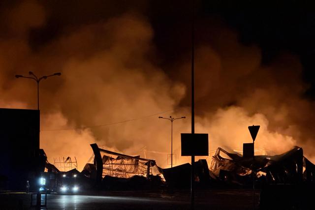 This photograph shows a fire at the site of a drone strike on a shopping centre in Sumy late at night on July 20, 2026, amid the Russian invasion of Ukraine. (Photo by Serhii Shapovalov (STR) / AFP)
