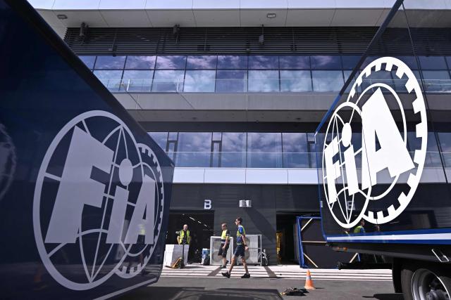 The logo of FIA (International Automobile Federation) and the Hungaroring's new main building are seen during a press tour at the renovated Mogyorod circuit, about 30 km from Hungarian capital Budapest, on July 21, 2026. The automobile sports center is completed as part of the Mogyoród circuit's renovation and modernization, with upgraded paddock, hospitality and media areas ahead of the Formula One Hungarian Grand Prix. (Photo by Attila KISBENEDEK / AFP)
