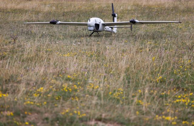 An unmanned Reliant reconnaissance drone of German manufacturer of civil and military surveillance drones Quantum Systems sits on the military grounds near Hohenfels, Bavaria, southern Germany, during a press presentation of the system, on July 21, 2026. Reliant is an unmanned reconnaissance system for long-range ISR (Intelligence, Surveillance and Reconnaissance) missions – will be demonstrated to you under realistic operational conditions. (Photo by Michaela STACHE / AFP)