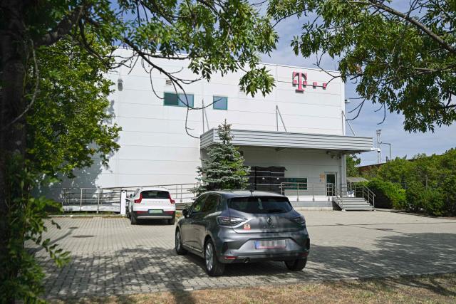A data server building owned by Hungarian Telekom, a German majority-owned company, is seen in Budapest on July 21, 2026, after a FIDESZ party spokesperson said that prosecutors had raided its data servers. The Fidesz party of Hungary's nationalist ex-leader Viktor Orban, which was swept from power in elections in April, said on July 21, 2026 that prosecutors had launched a raid on its server centre. (Photo by Attila KISBENEDEK / AFP)