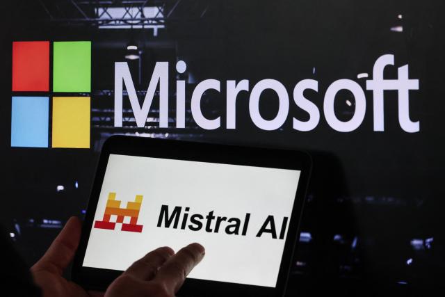 This illustration photograph shows the logos of Microsoft (top) and Mistral AI displayed on screens, in Paris on July 21, 2026. Microsoft and Mistral said on July 21, 2026 they had signed a "multibillion dollar" deal for the US tech giant to use the French AI developer's computing infrastructure in Europe. The agreement would grant Microsoft access to "Europe-based GPU (graphics processing unit) infrastructure to increase capacity for AI development and to support the delivery of Microsoft's cloud and AI services," the companies said in a joint statement. (Photo by Xavier GALIANA / AFP)