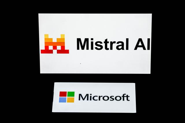 This illustration photograph shows the logos of Microsoft (bottom) and Mistral AI displayed on screens, in Paris on July 21, 2026. Microsoft and Mistral said on July 21, 2026 they had signed a "multibillion dollar" deal for the US tech giant to use the French AI developer's computing infrastructure in Europe. The agreement would grant Microsoft access to "Europe-based GPU (graphics processing unit) infrastructure to increase capacity for AI development and to support the delivery of Microsoft's cloud and AI services," the companies said in a joint statement. (Photo by Xavier GALIANA / AFP)