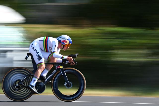 TOPSHOT - Red Bull - BORA - hansgrohe team's Belgian rider Remco Evenepoel cycles during the 16th stage of the 113th edition of the Tour de France cycling race, 26,1 km time trial between Évian-les-Bains and Thonon-les-Bains in the French Alps, on July 21, 2026. (Photo by Anne-Christine POUJOULAT / AFP)