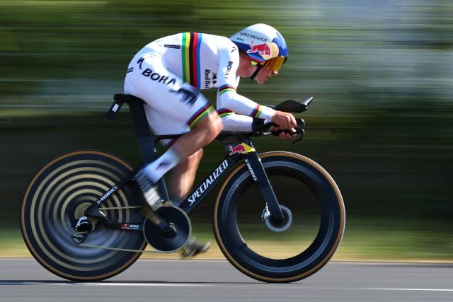 Red Bull - BORA - hansgrohe team's Belgian rider Remco Evenepoel cycles during the 16th stage of the 113th edition of the Tour de France cycling race, 26,1 km time trial between Évian-les-Bains and Thonon-les-Bains in the French Alps, on July 21, 2026. (Photo by Anne-Christine POUJOULAT / AFP)