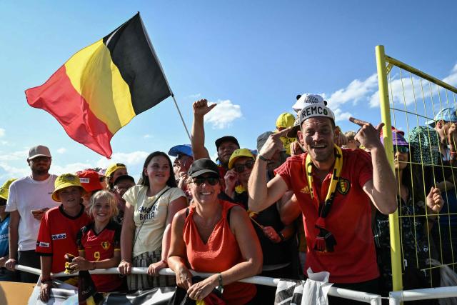 spectators cheer for Red Bull - BORA - hansgrohe team's Belgian rider Remco Evenepoel at the finish line of the 16th stage of the 113th edition of the Tour de France cycling race, 26 km between Évian-les-Bains and Thonon-les-Bains in the French Alps, on July 21, 2026. (Photo by Jeff PACHOUD / AFP)