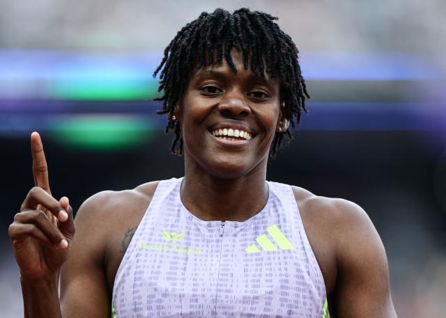 (FILES) Dominican Republic's Marileidy Paulino celebrates after winning the women's 400m event during the IAAF Diamond League athletics competition at the London stadium in London on July 18, 2026. Dominican athletics star Marileidy Paulino is “excited” as she prepares to beat her personal best in the 400 metres at the 2026 Central American and Caribbean Games in Santo Domingo, which she described as being like “the Olympics at home” in an interview with AFP published on July 21, 2026. (Photo by Henry NICHOLLS / AFP)