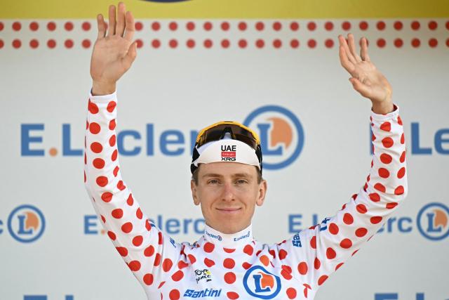 UAE Team Emirates - XRG's Slovenian rider Tadej Pogacar celebrates on the podium with the best climber's polka dot (dotted) jersey after the 16th stage of the 113th edition of the Tour de France cycling race, 26 km between Évian-les-Bains and Thonon-les-Bains in the French Alps, on July 21, 2026. (Photo by Loic VENANCE / AFP)