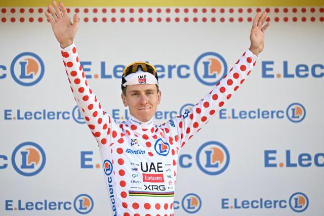 UAE Team Emirates - XRG's Slovenian rider Tadej Pogacar celebrates on the podium with the best climber's polka dot (dotted) jersey after the 16th stage of the 113th edition of the Tour de France cycling race, 26 km between Évian-les-Bains and Thonon-les-Bains in the French Alps, on July 21, 2026. (Photo by Loic VENANCE / AFP)