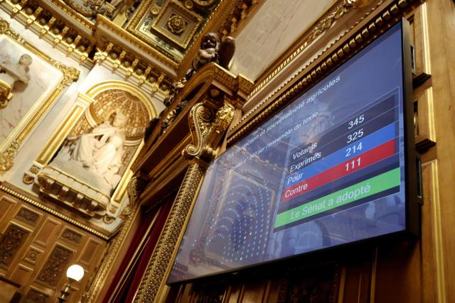 This photograph shows a giant screen with the result of the vote after to a session examine and vote the final draft of emergency bill for agricultural protection and sovereignty, at the Senat in Paris on July 21, 2026. (Photo by Ludovic MARIN / AFP)