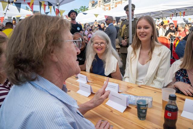 Belgium's Princess Eleonore (R) attends the "Everyone to the Table" event to celebrate Belgium's National Day at Place du Jeu de Balle in Brussels on July 21, 2026. (Photo by JONAS ROOSENS / Belga / AFP) / Belgium OUT