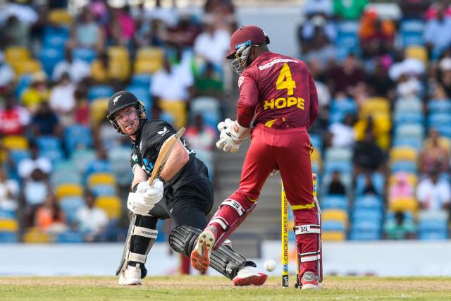 Batsman Nick Kelly of New Zealand (L) plays a shot for four runs past wicketkeeper Shai Hope of West Indies during the fifth and final one day international (ODI) cricket match between West Indies and New Zealand at Kensington Oval in Bridgetown, Barbados on July 21, 2026. (Photo by Randy Brooks / AFP)