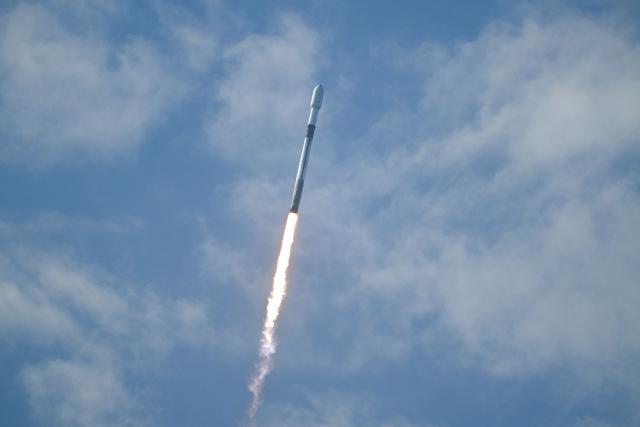 A SpaceX Falcon 9 rocket carrying Northrop Grumman's Mission Robotic Vehicle (MRV) and Mission Extension Pods (MEPs) is seen after launching from Space Force Station's Launch Complex 40 in Cape Canaveral, Florida, on July 21, 2026. (Photo by CHANDAN KHANNA / AFP)